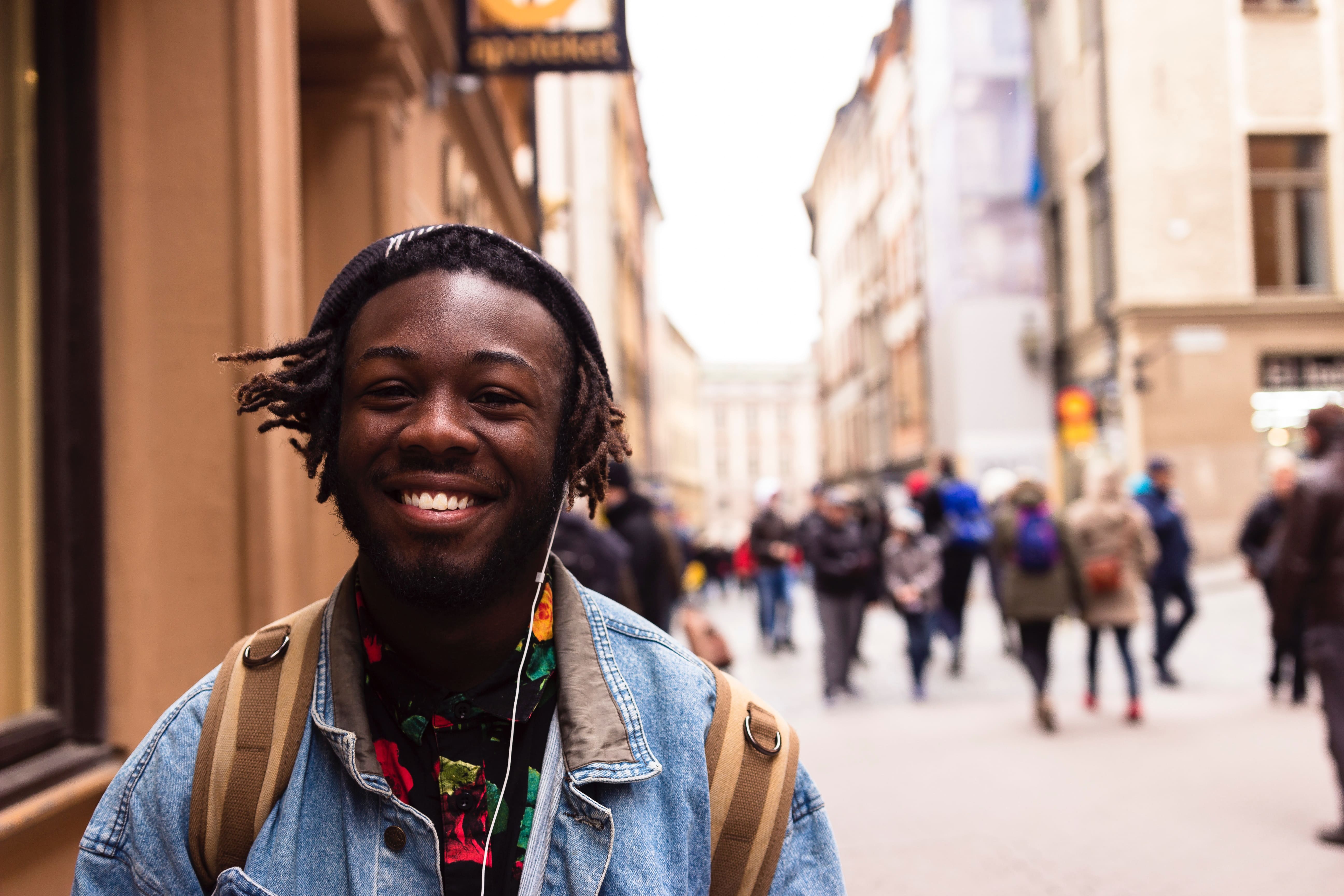 man smiling listening to music